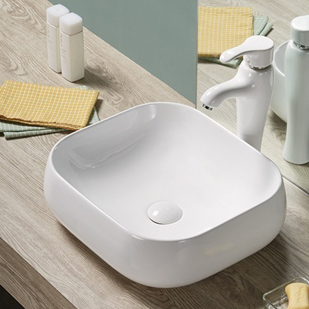 Lavabo de color blanco con encimera para tocador sobre mesa